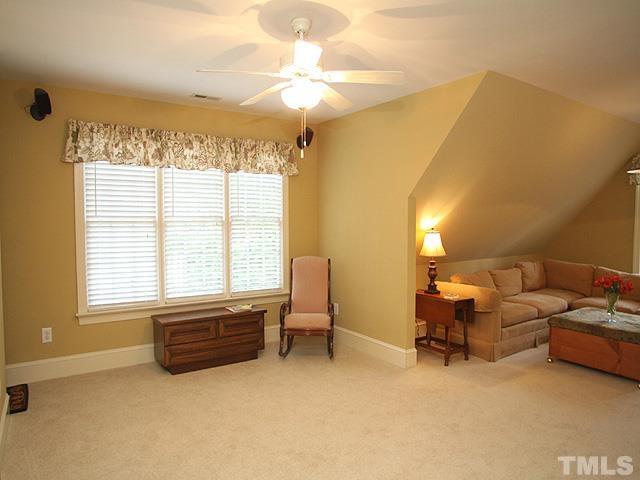 236 Release Circle Raleigh, NC 27615 - Photo 10 of 25 a living room with furniture and a chandelier