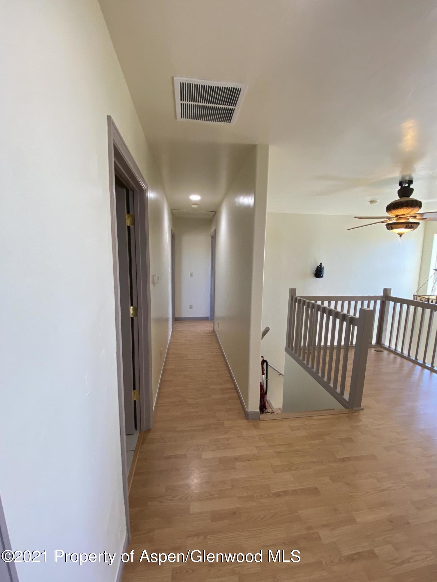 658 Cindys Way Rifle, CO 81650 - Photo 11 of 30 a view of a hallway with staircase