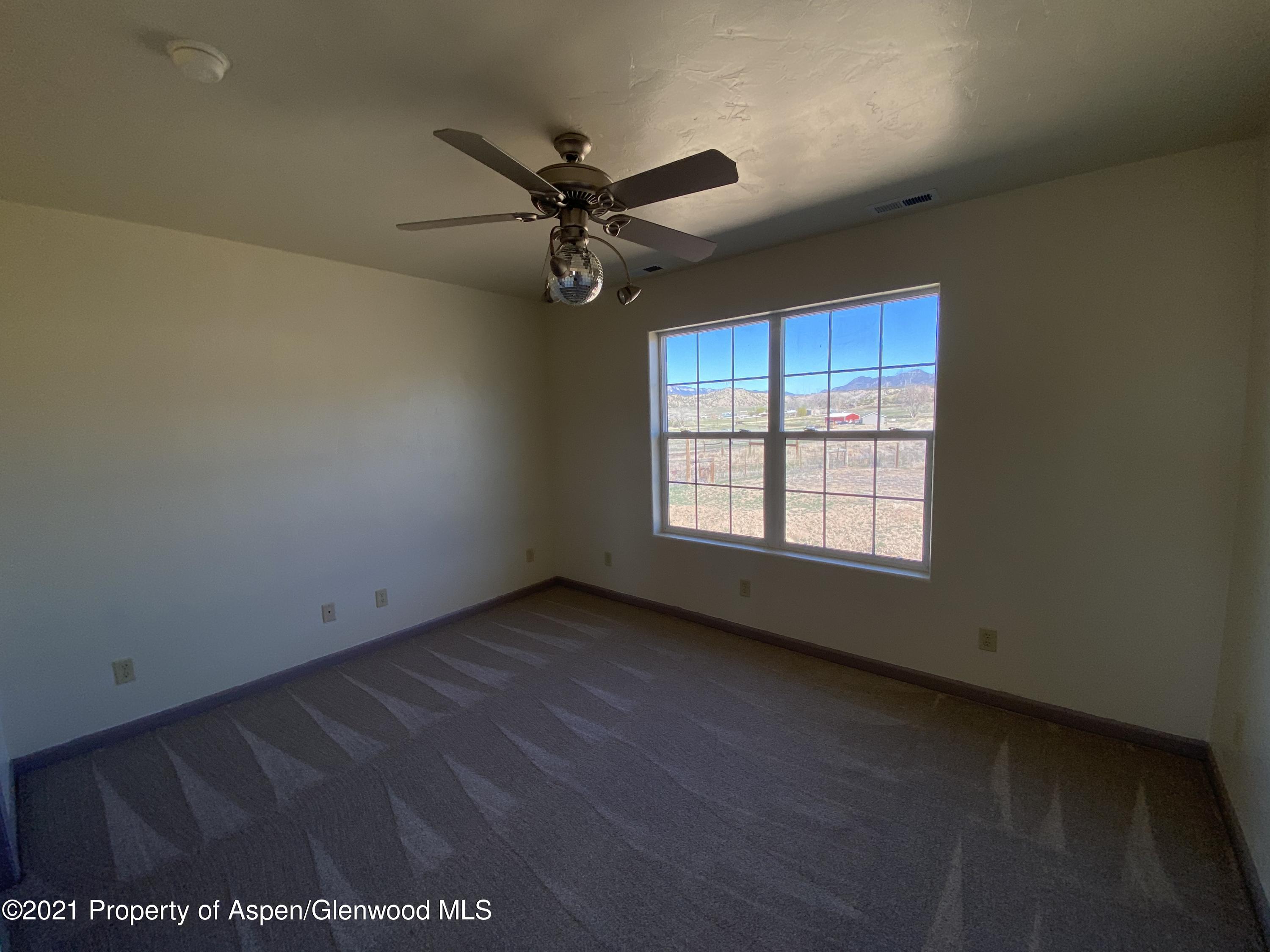 658 Cindys Way Rifle, CO 81650 - Photo 14 of 30 an empty room with a window