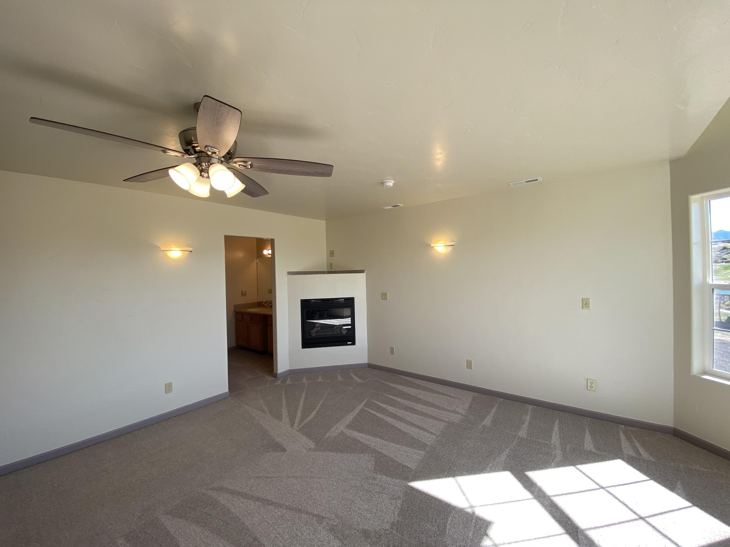 658 Cindys Way Rifle, CO 81650 - Photo 17 of 30 a view of a livingroom with a ceiling fan and window