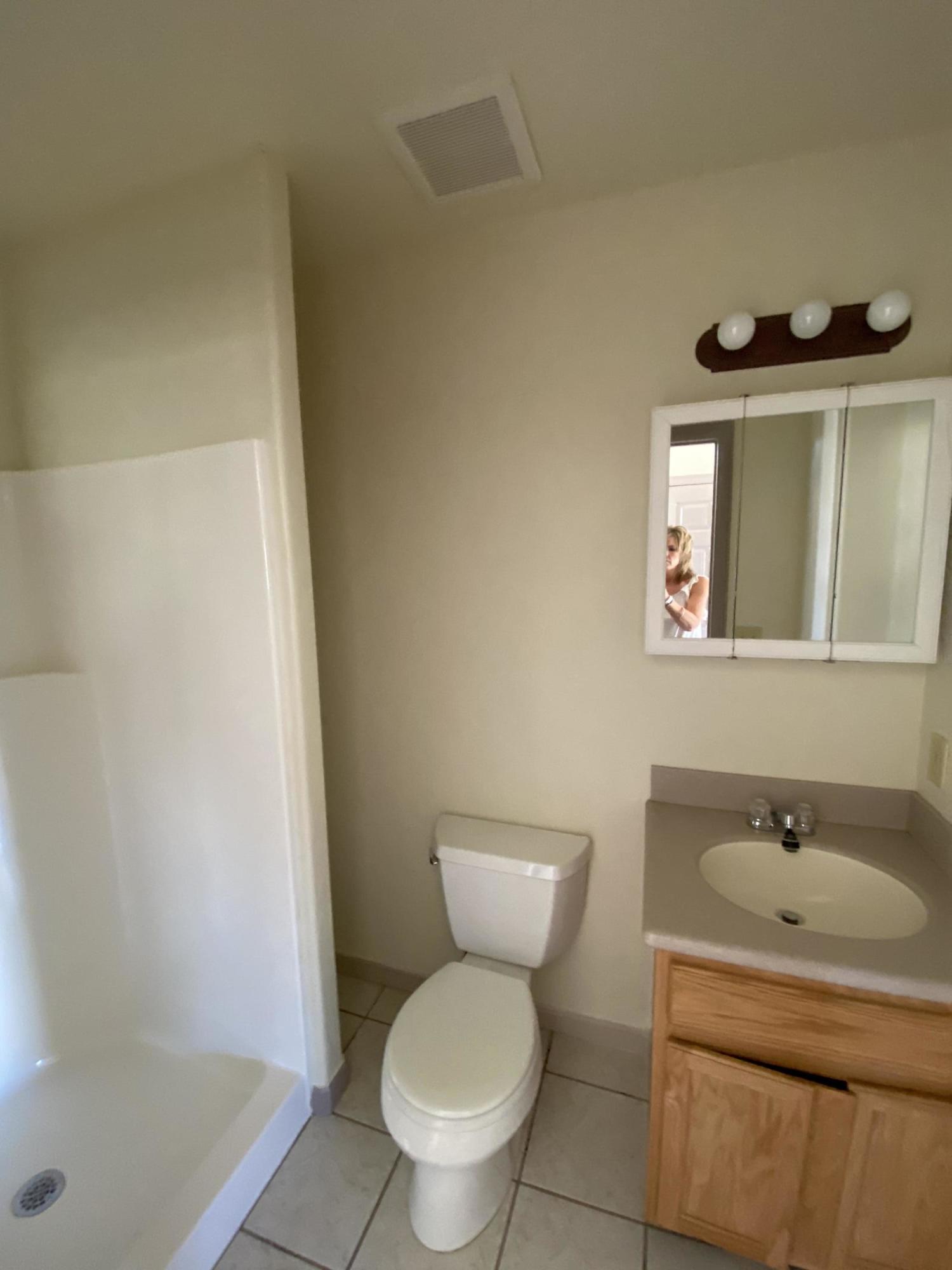 658 Cindys Way Rifle, CO 81650 - Photo 22 of 30 a white toilet sitting next to a bathroom sink