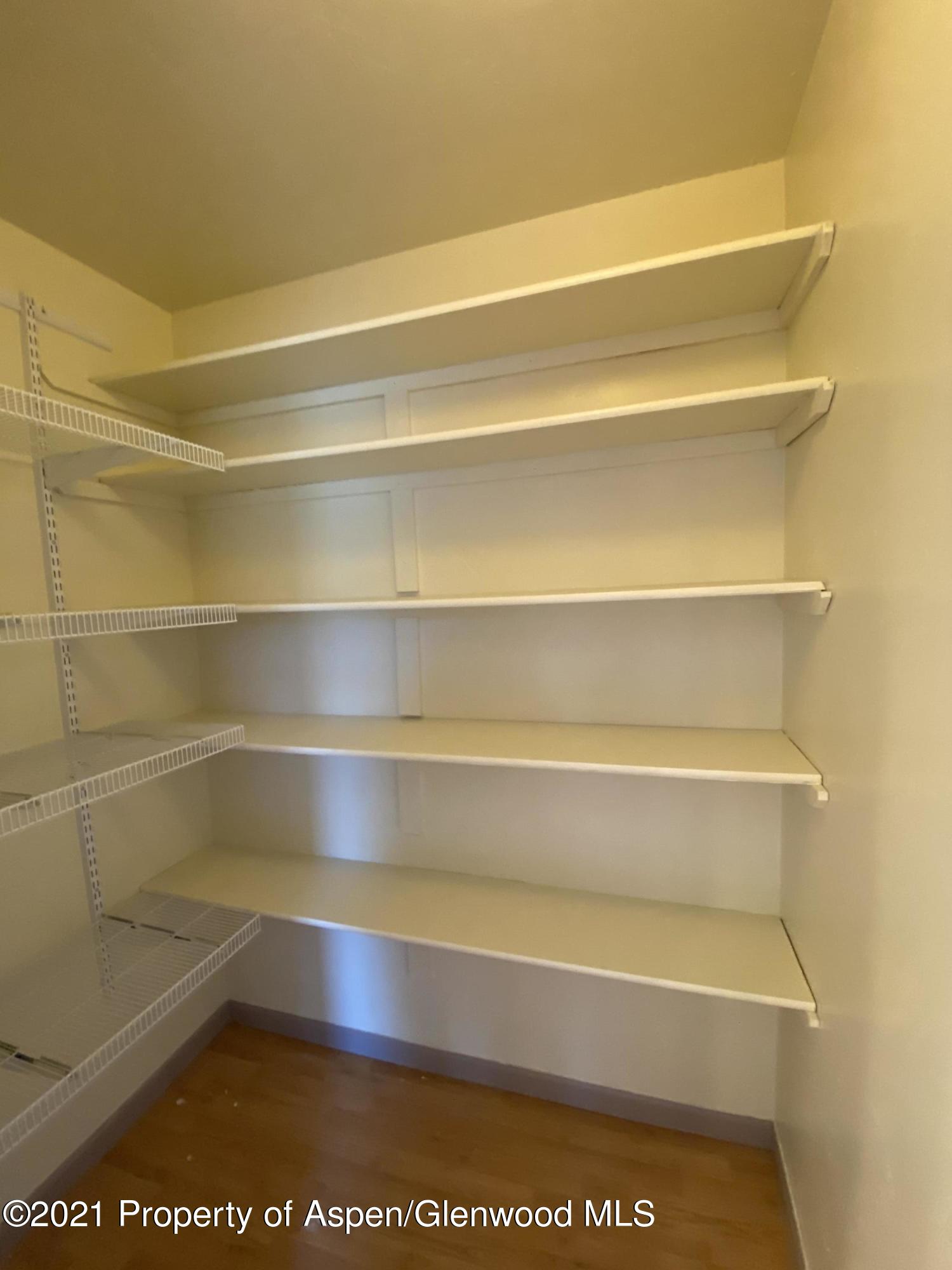 658 Cindys Way Rifle, CO 81650 - Photo 5 of 30 a view of walk in closet with empty racks