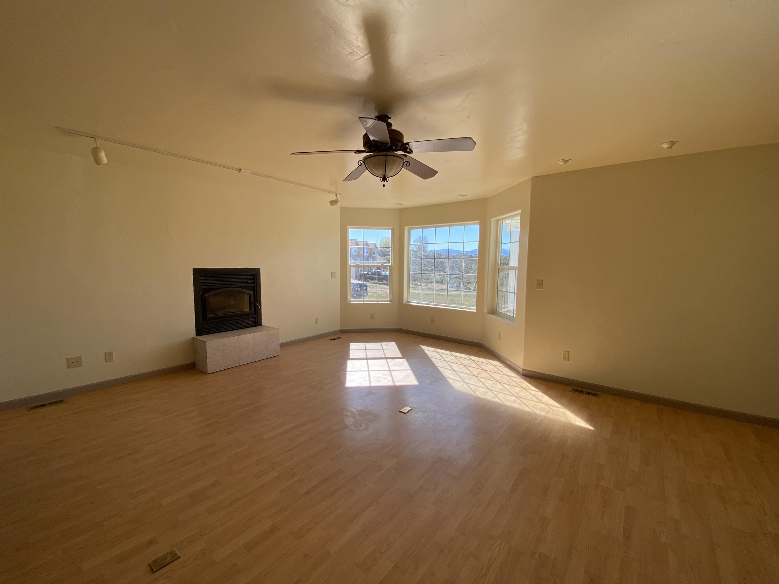 658 Cindys Way Rifle, CO 81650 - Photo 8 of 30 an empty room with a empty space and windows