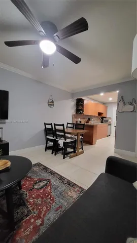 a room with furniture and a flat screen tv