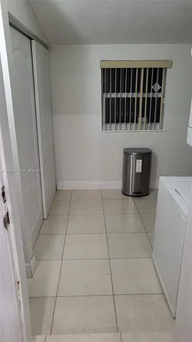 a view of storage and utility room with washer and dryer