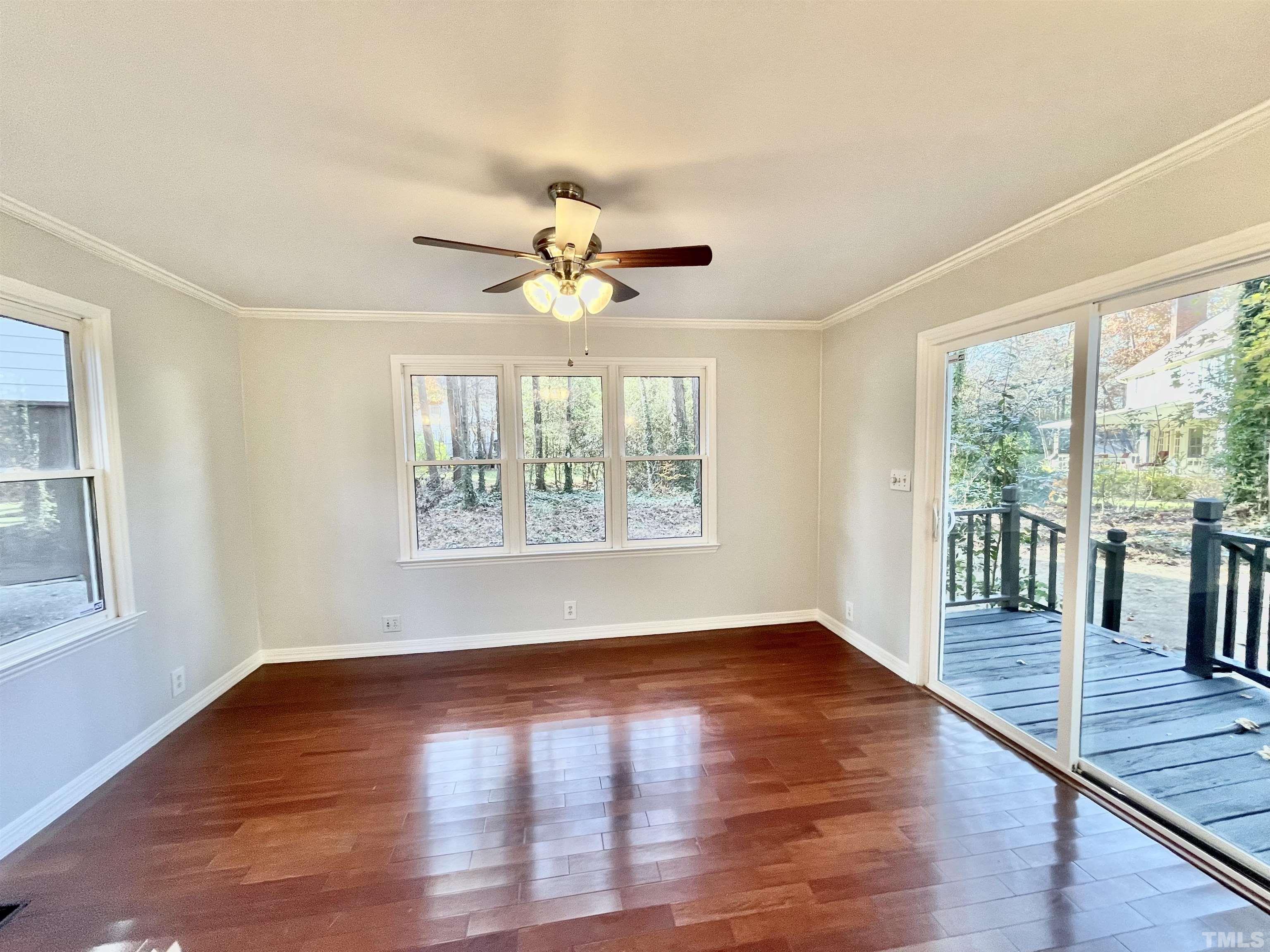 3101 Paxton Place Raleigh, NC 27613 - Photo 14 of 28 wooden floor in an empty room with a window