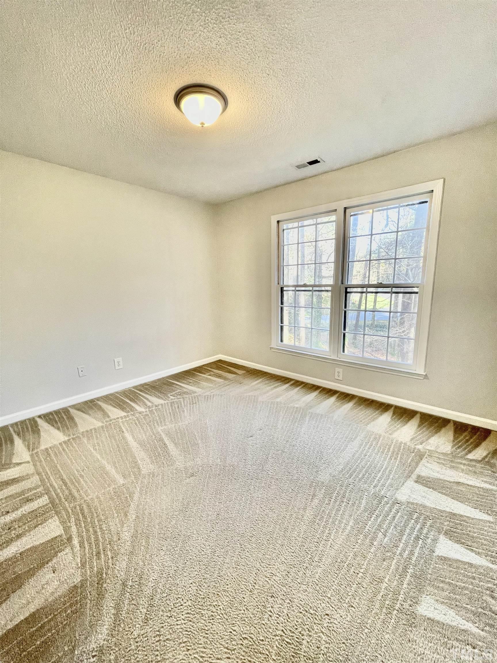 3101 Paxton Place Raleigh, NC 27613 - Photo 22 of 28 a view of an empty room with a window