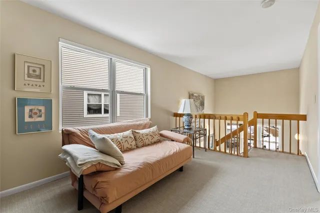 a living room with furniture and windows