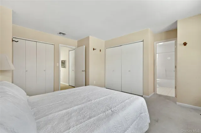 a bedroom with a bed and a shower