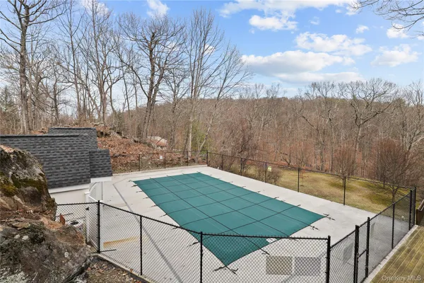 a view of a backyard with sitting area