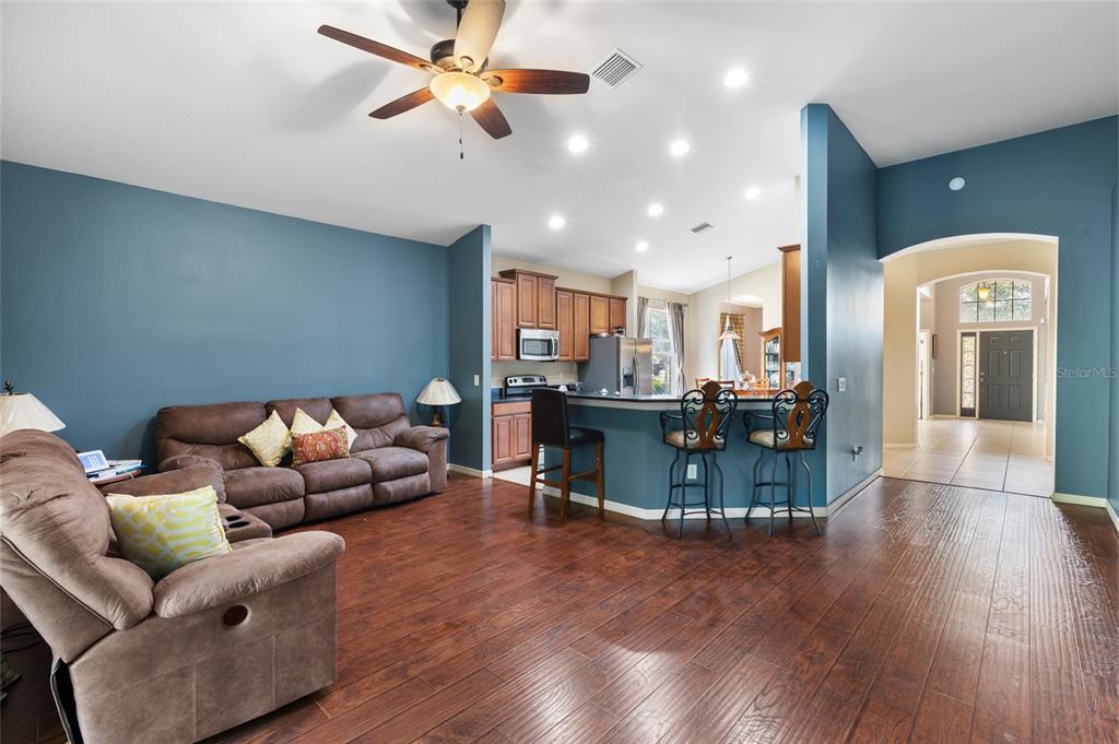 10925 Rockledge View Drive Riverview, FL 33579 - Photo 15 of 49 a living room with furniture and kitchen view