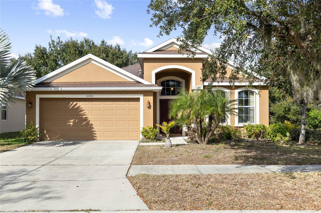 10925 Rockledge View Drive Riverview, FL 33579 - Photo 2 of 49 a front view of a house with garden