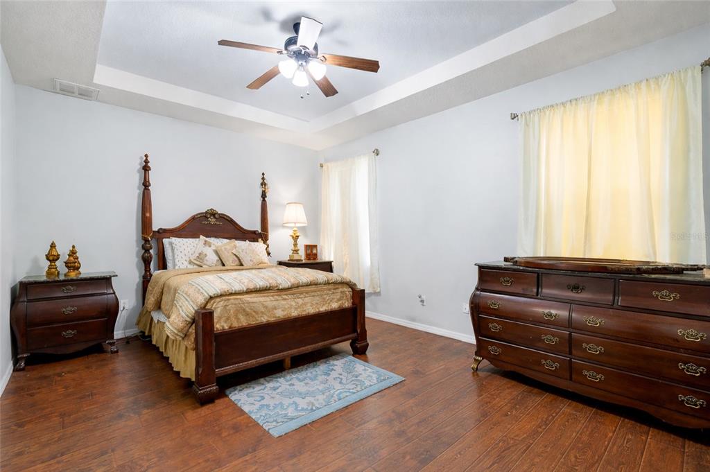 10925 Rockledge View Drive Riverview, FL 33579 - Photo 28 of 49 a bedroom with a bed dresser and a window