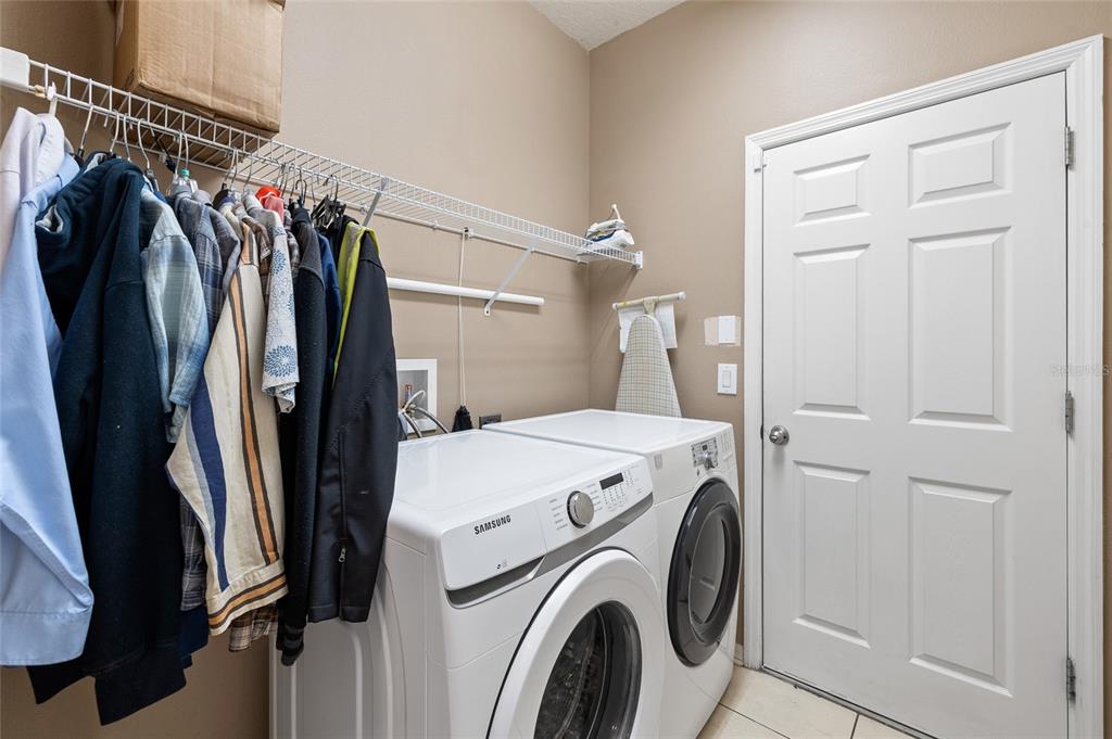 10925 Rockledge View Drive Riverview, FL 33579 - Photo 35 of 49 a view of walk in closet with clothes and shoes