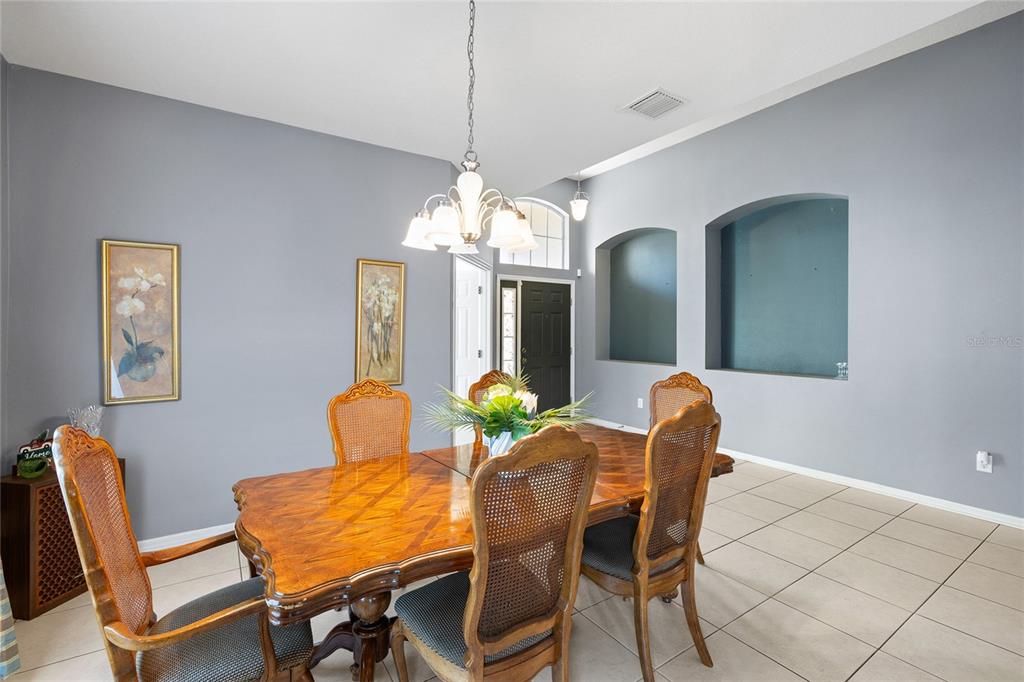 10925 Rockledge View Drive Riverview, FL 33579 - Photo 5 of 49 a dining room with furniture and chandelier