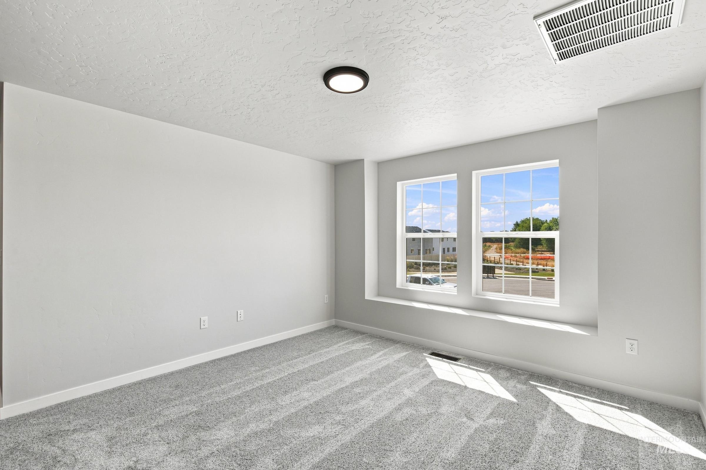 464 Merlin Court Middleton, ID 83644 - Photo 14 of 26 Neutral-toned walls complement plush grey carpeting