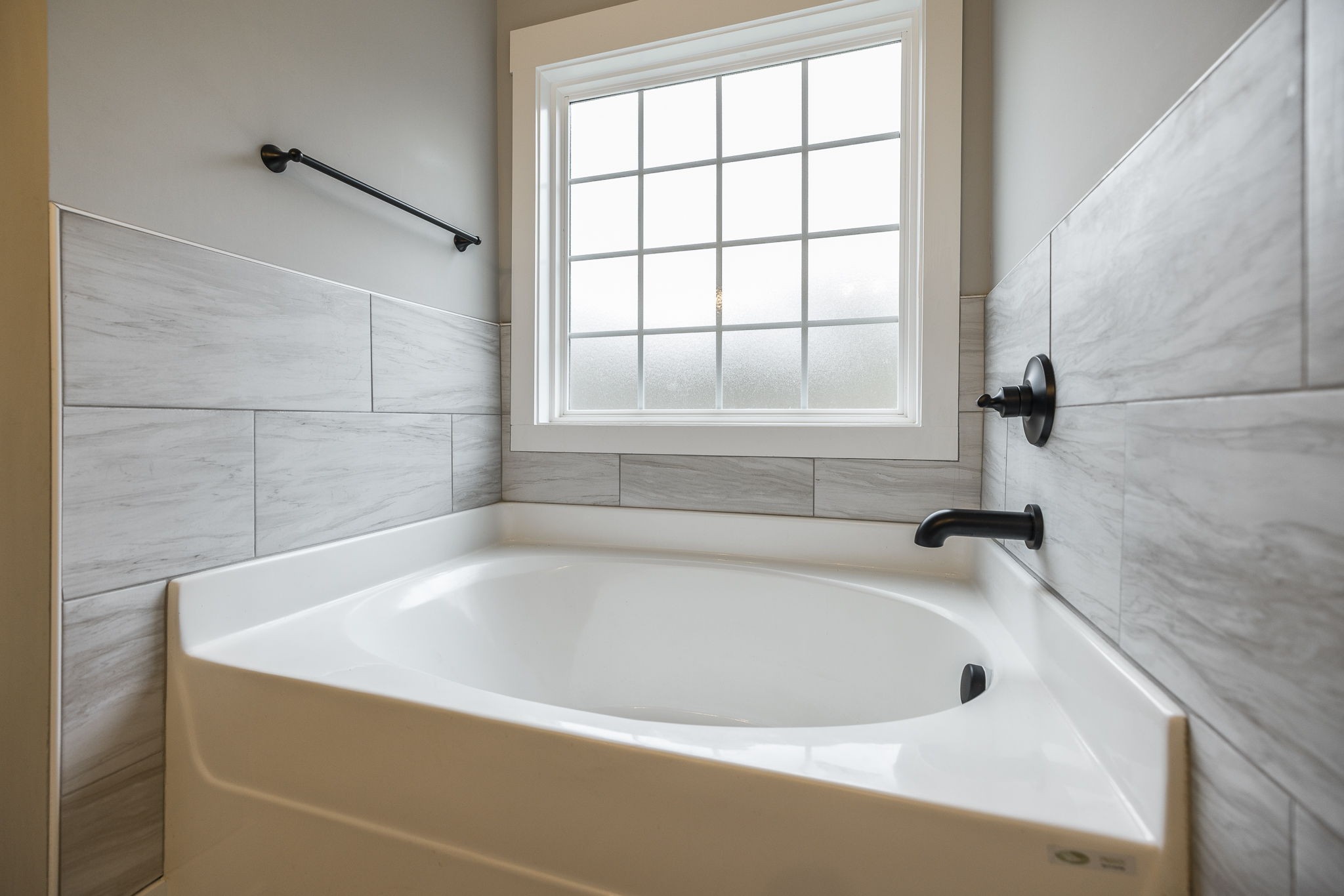 1845 Dinsmore Road Clarksville, TN 37040 - Photo 19 of 70 a white bath tub sitting in a bathroom next to a window