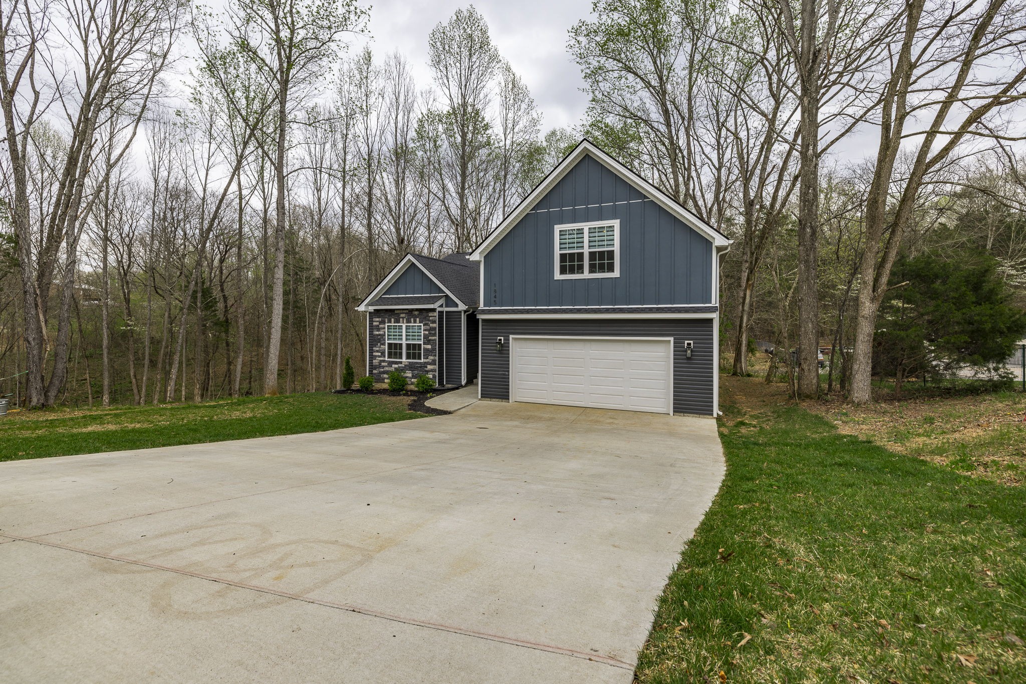 1845 Dinsmore Road Clarksville, TN 37040 - Photo 2 of 70 a front view of a house with yard and trees