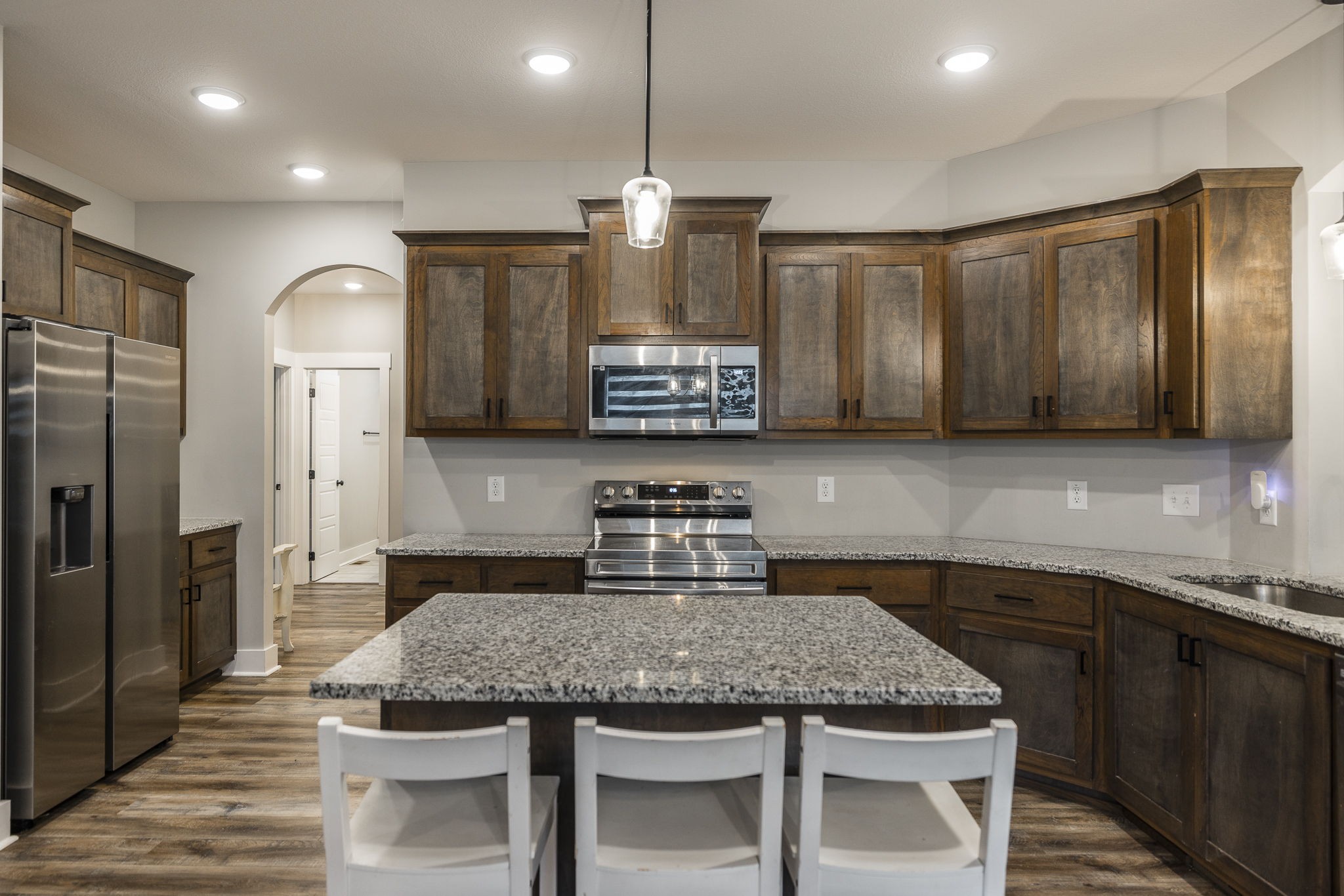 1845 Dinsmore Road Clarksville, TN 37040 - Photo 34 of 70 a kitchen with stainless steel appliances granite countertop a kitchen island a stove and a refrigerator