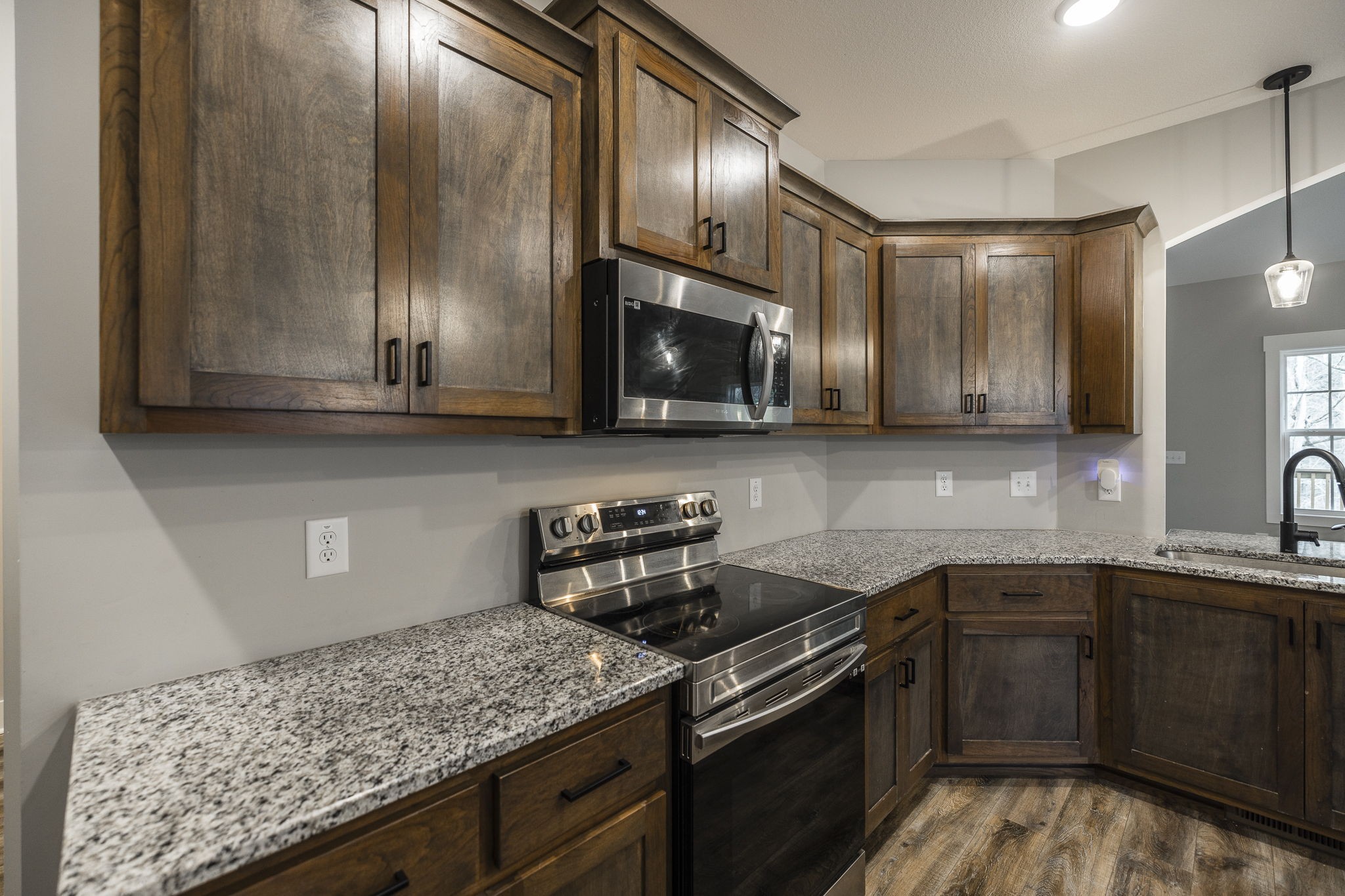 1845 Dinsmore Road Clarksville, TN 37040 - Photo 36 of 70 a kitchen with stainless steel appliances granite countertop a sink stove and cabinets
