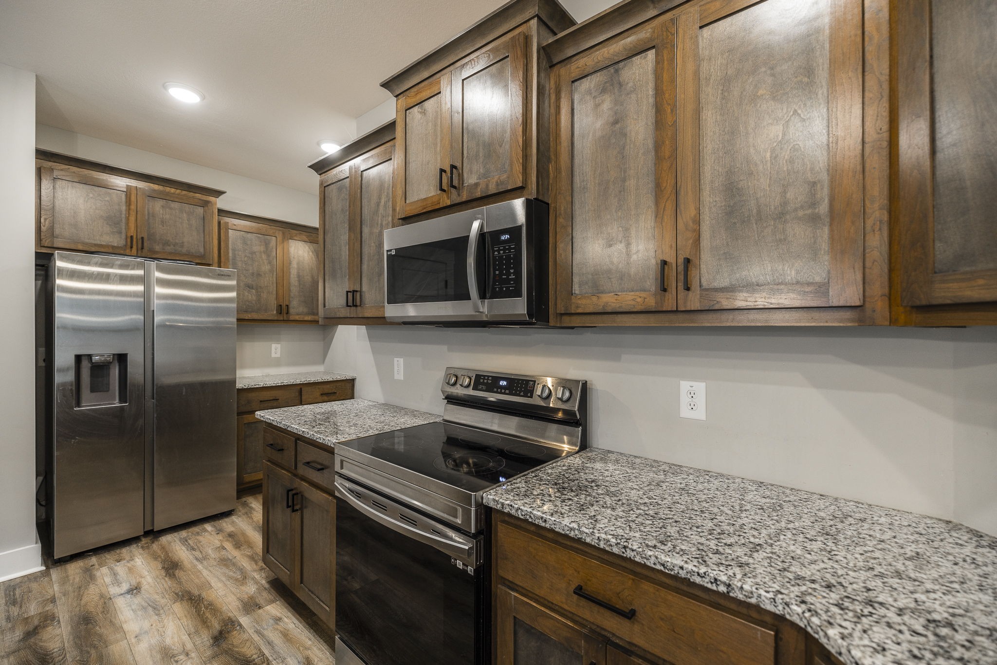 1845 Dinsmore Road Clarksville, TN 37040 - Photo 37 of 70 a kitchen with stainless steel appliances granite countertop a sink stove and refrigerator