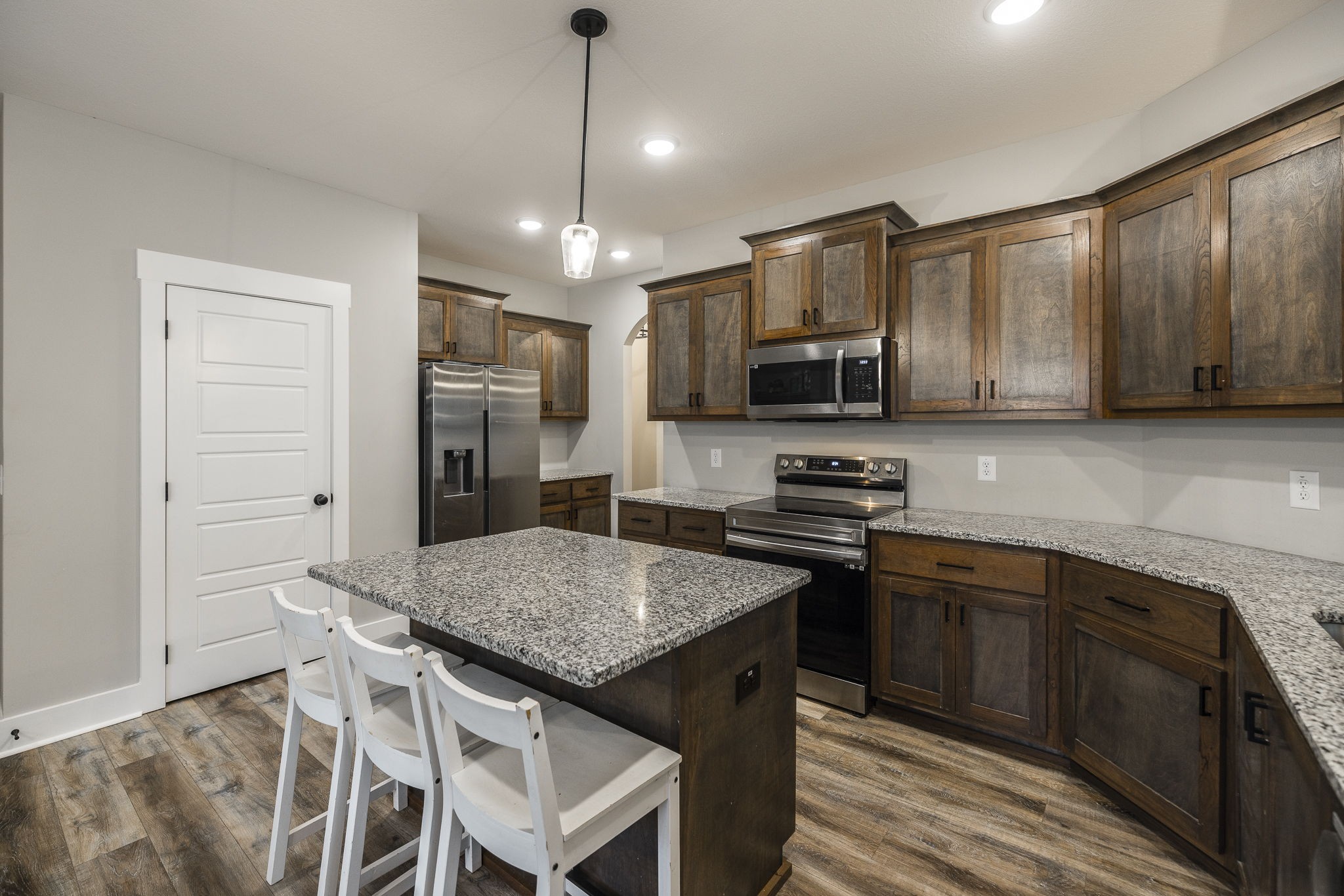 1845 Dinsmore Road Clarksville, TN 37040 - Photo 38 of 70 a kitchen with stainless steel appliances granite countertop a stove refrigerator sink and microwave