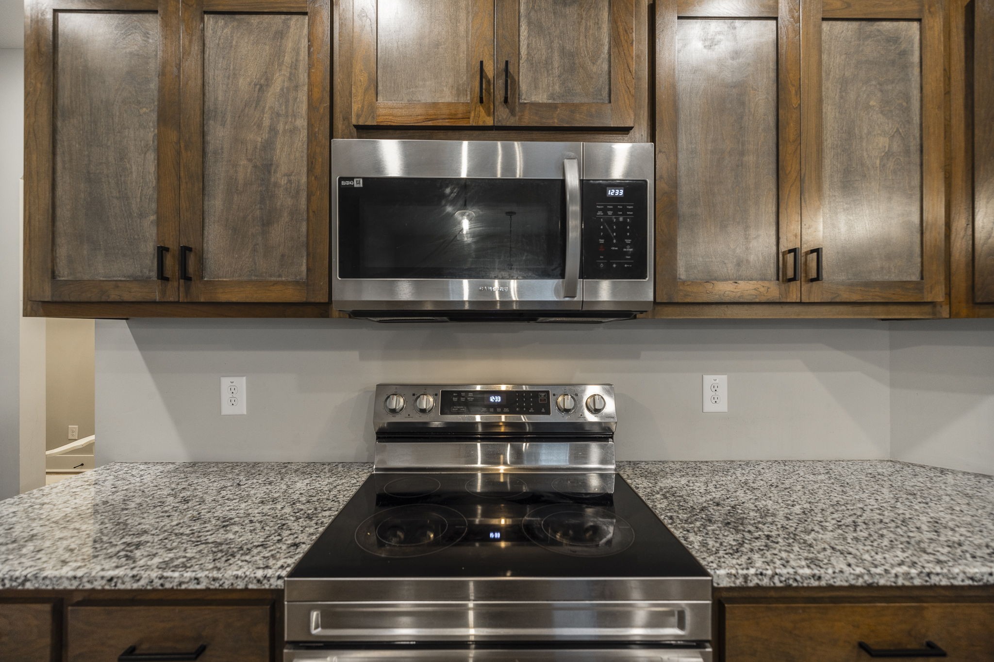 1845 Dinsmore Road Clarksville, TN 37040 - Photo 42 of 70 a kitchen with granite countertop a stove and a microwave