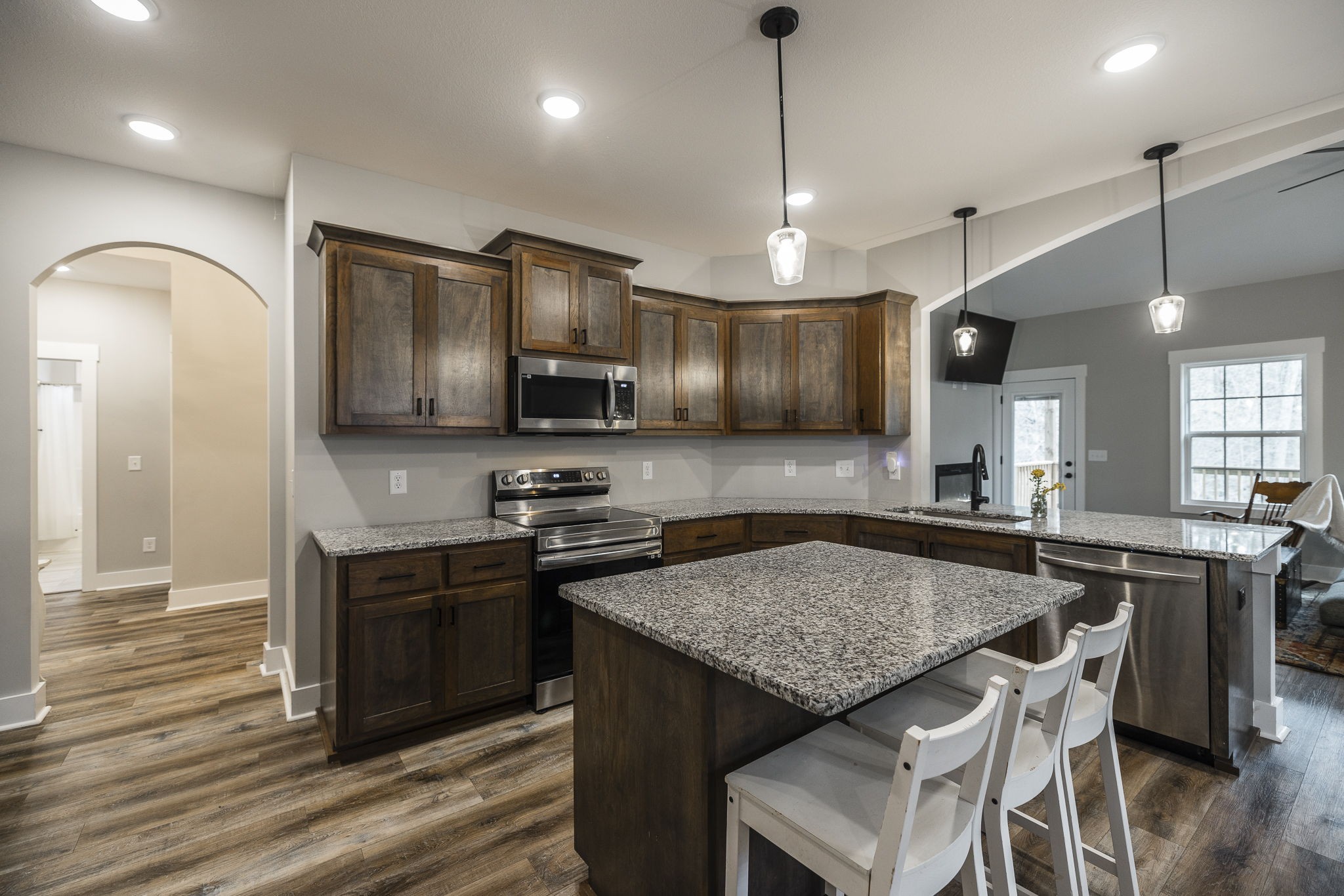 1845 Dinsmore Road Clarksville, TN 37040 - Photo 43 of 70 a kitchen with granite countertop stove microwave and refrigerator