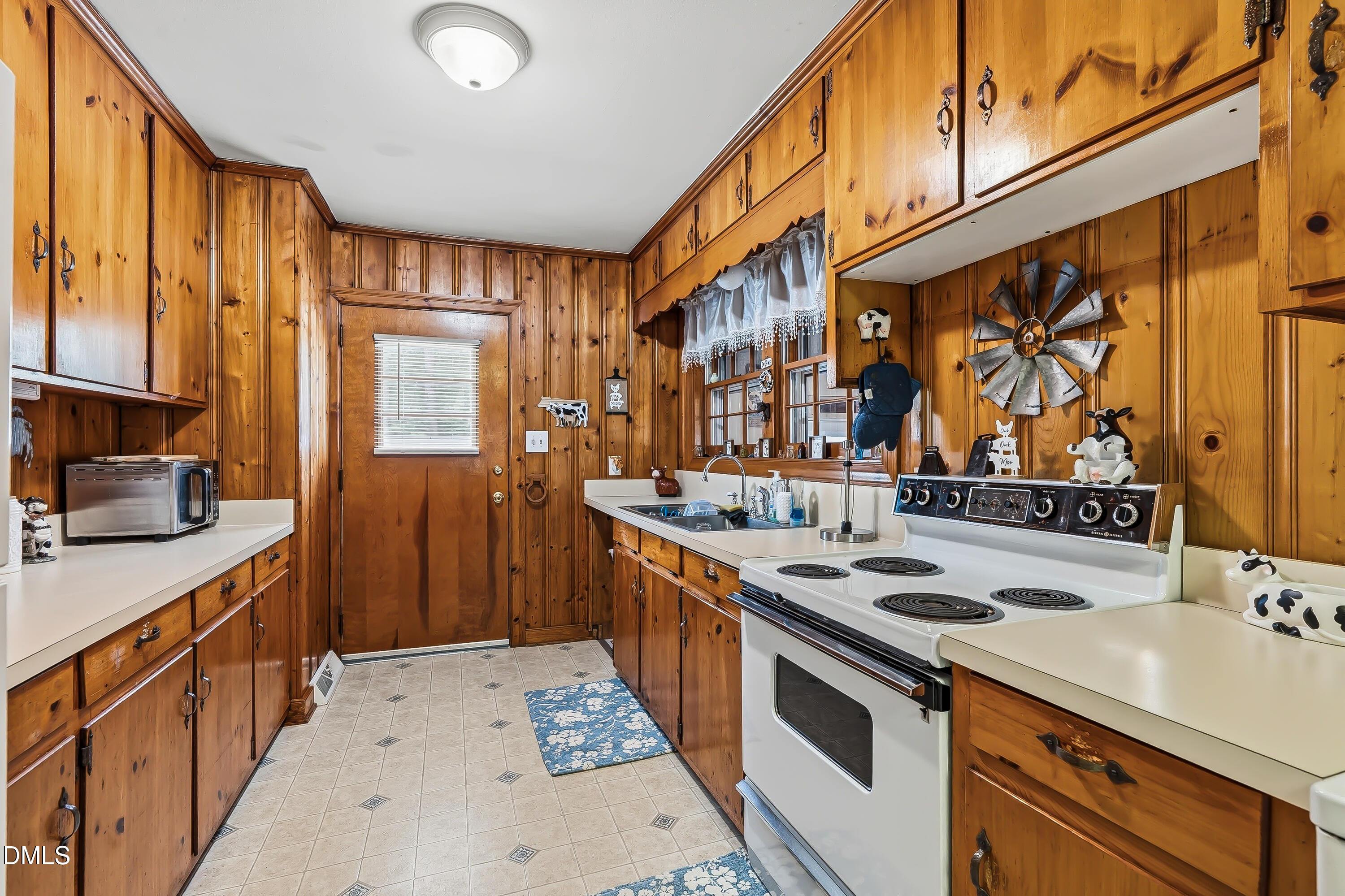 4967 Highway 581 Spring Hope, NC 27882 - Photo 25 of 44 a kitchen that has a sink and a stove