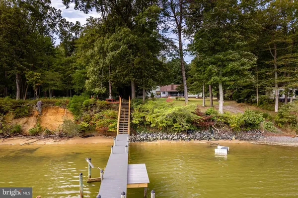 a view of a swimming pool with lounge chair