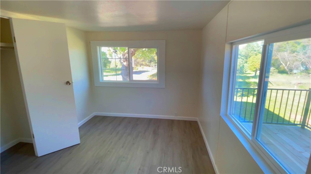 5440 Darrah Road Mariposa, CA 95338 - Photo 24 of 26 a view of an empty room with wooden floor and a window