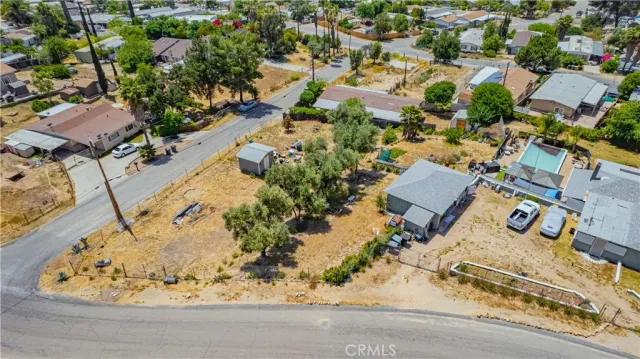 an aerial view of a houses with a yard