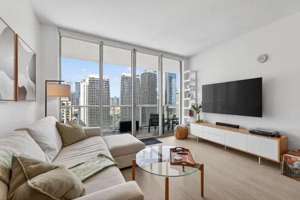 a living room with furniture and a flat screen tv