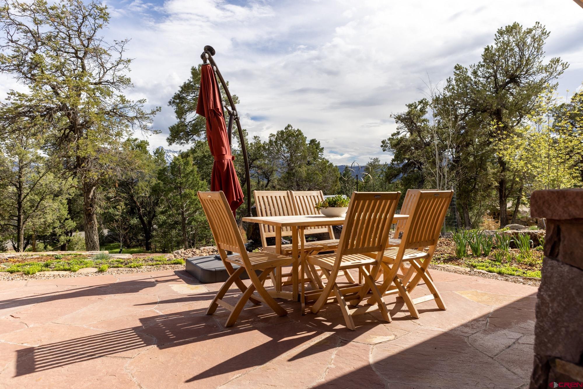 6534 Pleasant Point Drive Ridgway, CO 81432 - Photo 12 of 35 a view of a patio with a table and chairs