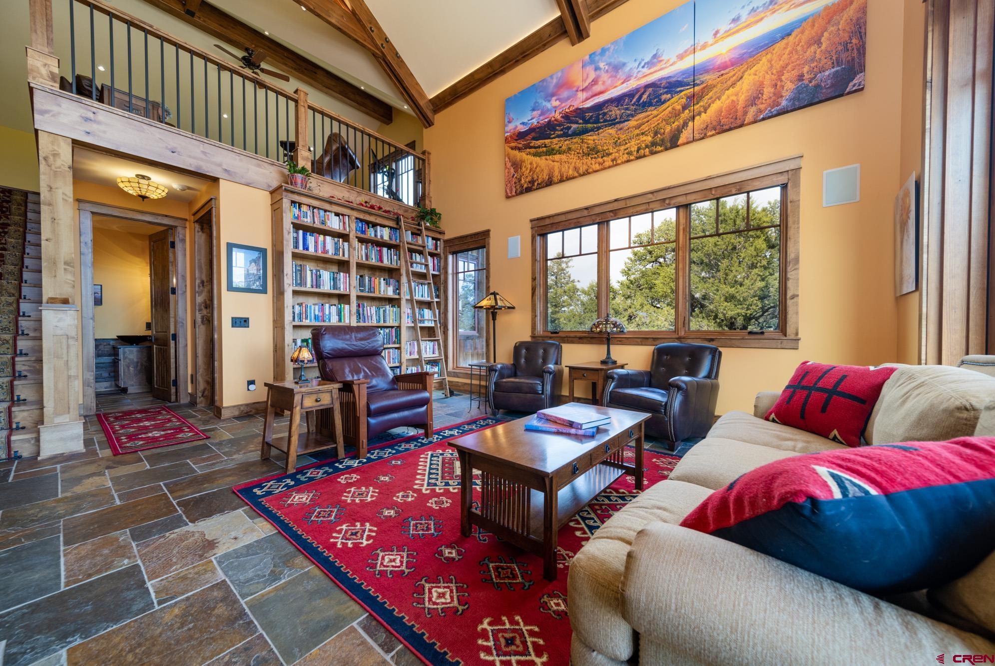 6534 Pleasant Point Drive Ridgway, CO 81432 - Photo 19 of 35 a living room with furniture a rug and windows