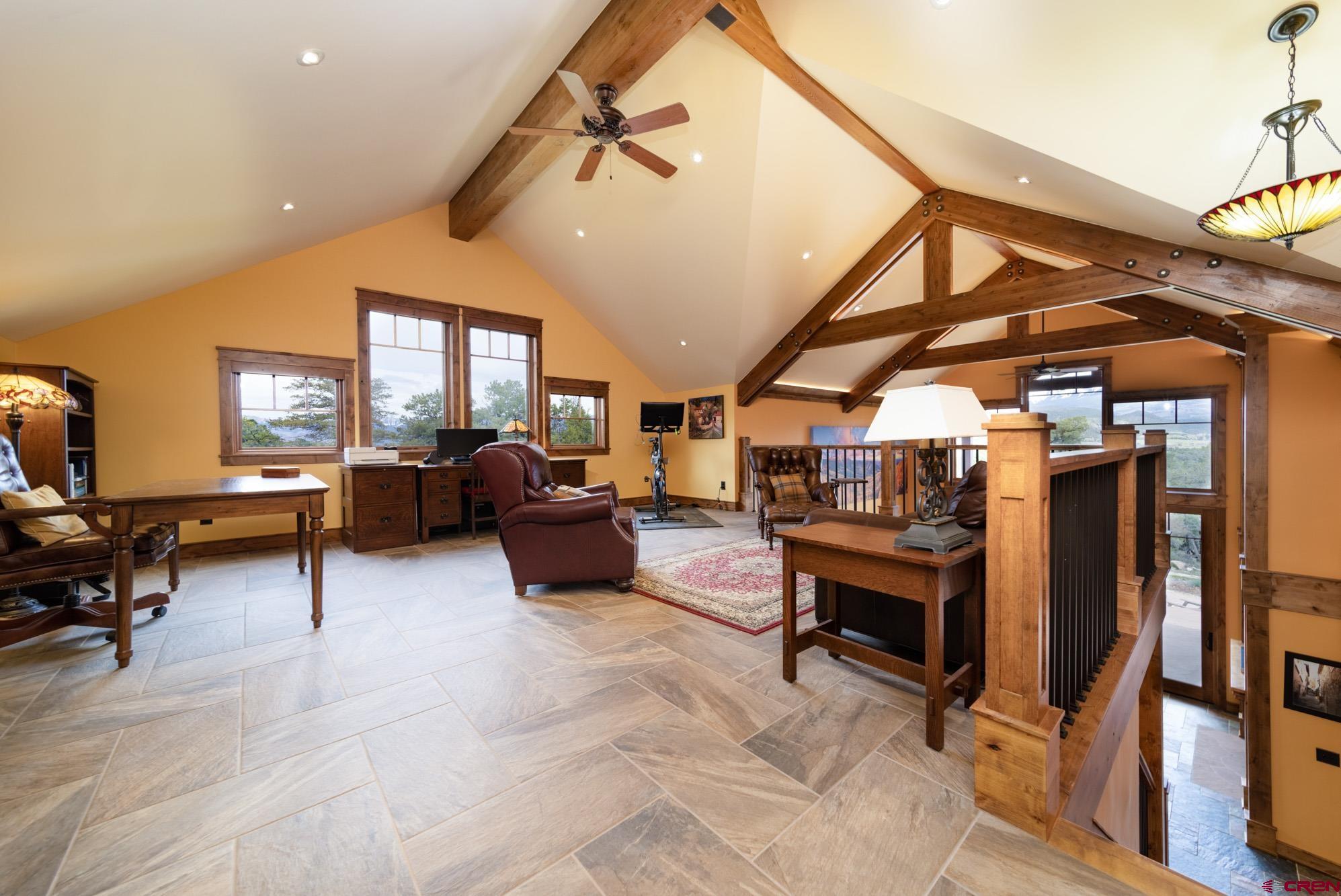 6534 Pleasant Point Drive Ridgway, CO 81432 - Photo 26 of 35 a living room with furniture and a flat screen tv