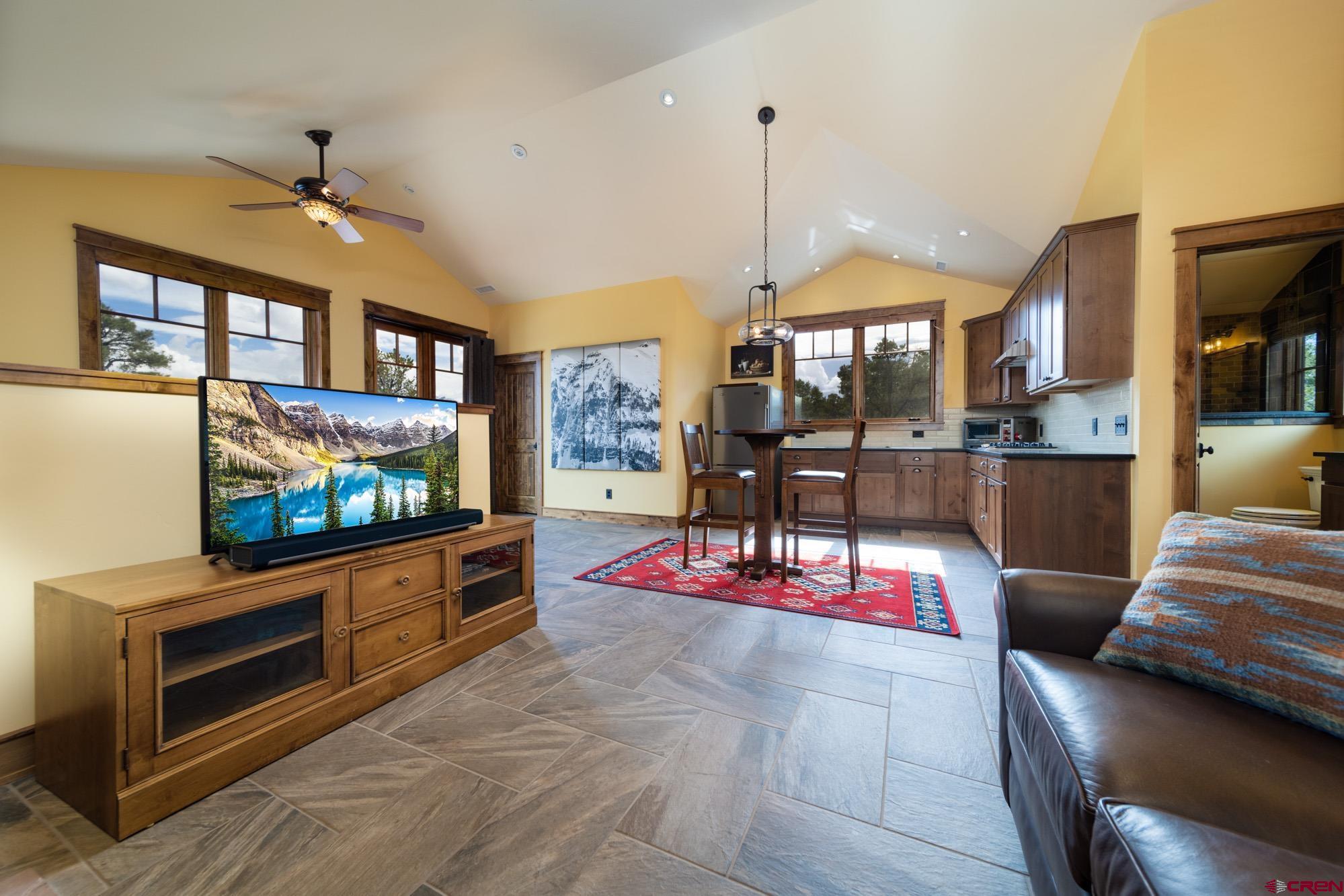 6534 Pleasant Point Drive Ridgway, CO 81432 - Photo 28 of 35 a living room with furniture and a flat screen tv