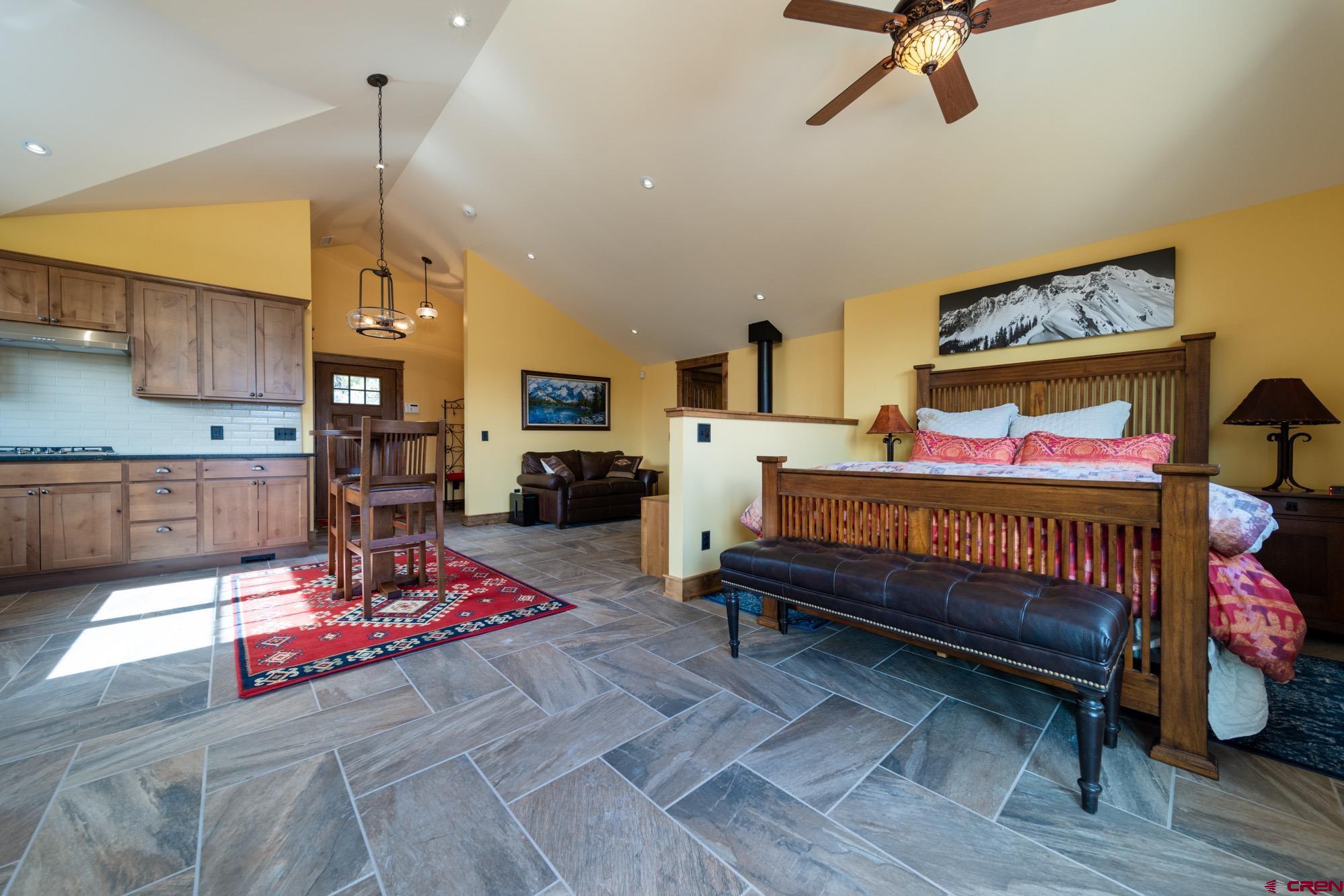 6534 Pleasant Point Drive Ridgway, CO 81432 - Photo 30 of 35 a living room with furniture and kitchen view