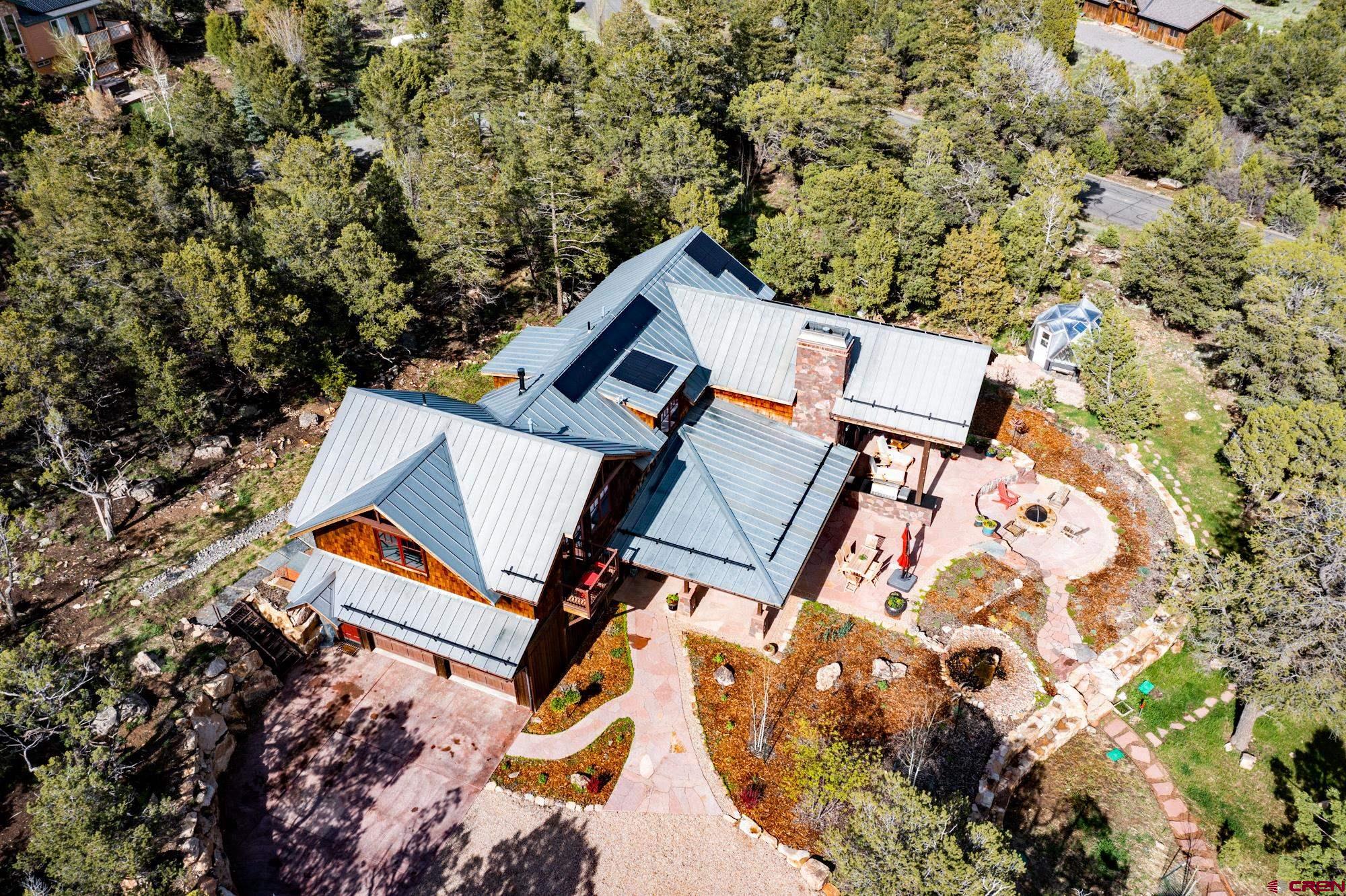 6534 Pleasant Point Drive Ridgway, CO 81432 - Photo 3 of 35 an aerial view of a backyard with table and chairs