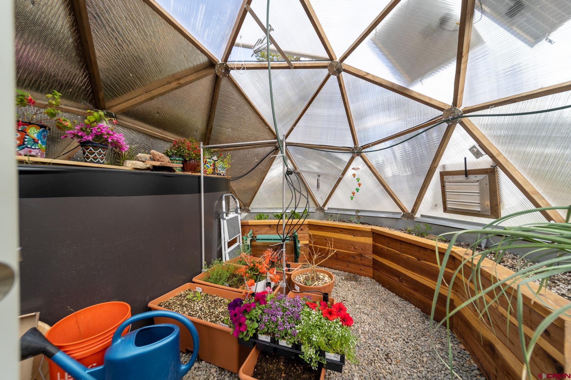 6534 Pleasant Point Drive Ridgway, CO 81432 - Photo 33 of 35 a room with lots of flowers and furniture