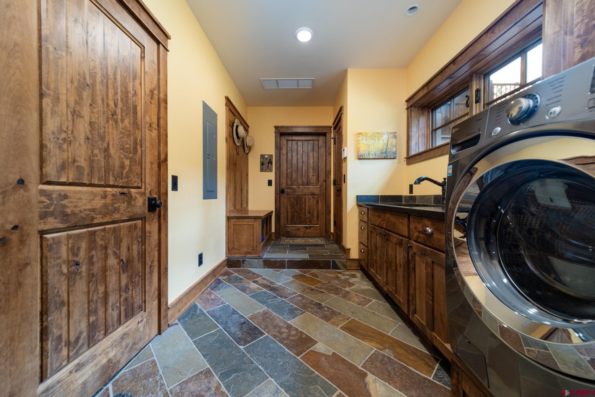 6534 Pleasant Point Drive Ridgway, CO 81432 - Photo 34 of 35 a view of a hallway with washer and dryer