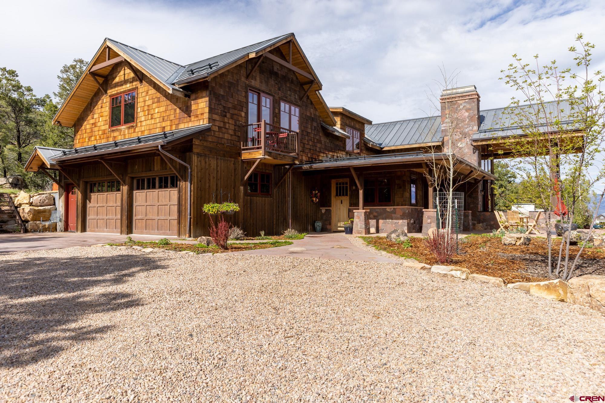 6534 Pleasant Point Drive Ridgway, CO 81432 - Photo 5 of 35 a front view of a house with a porch