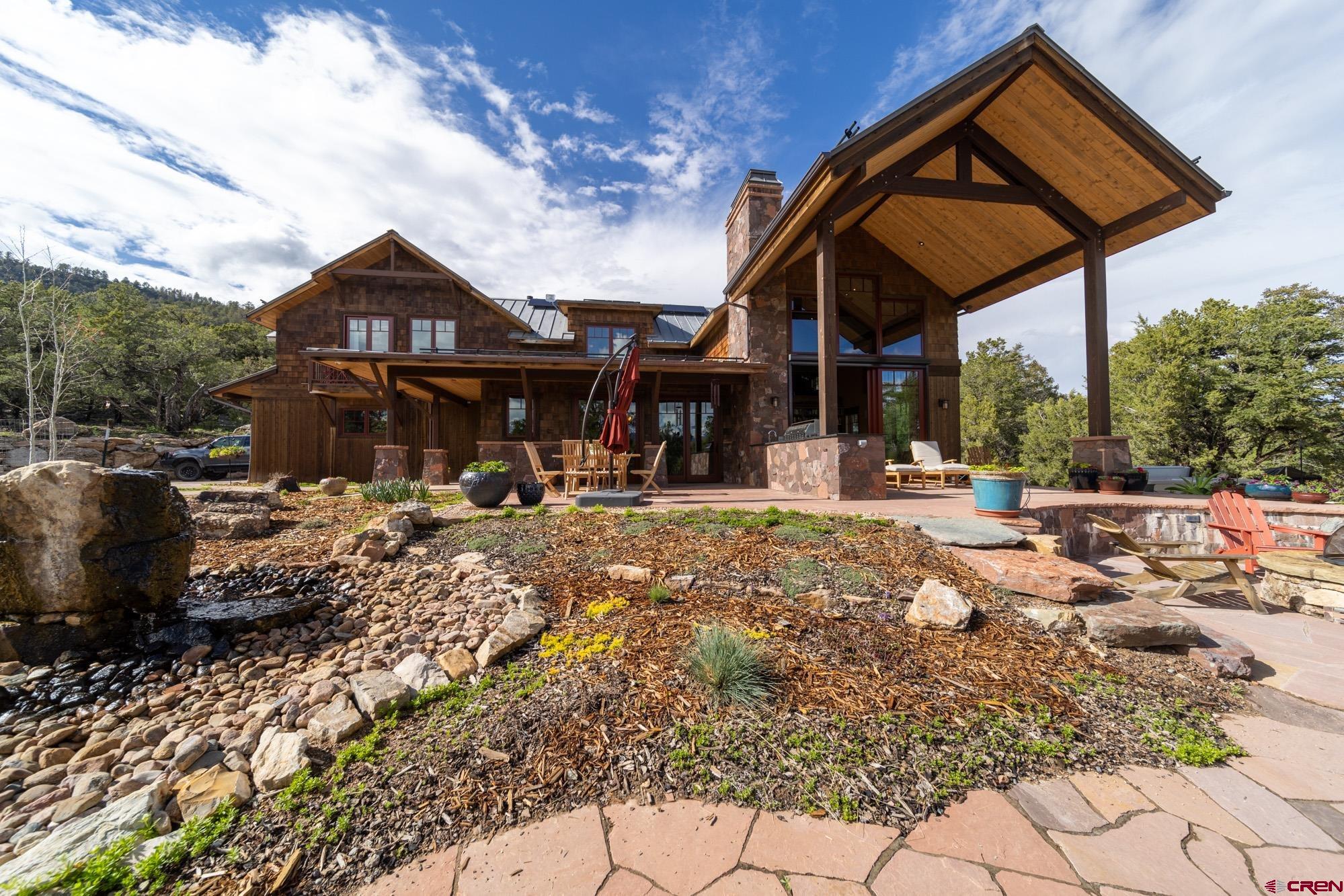 6534 Pleasant Point Drive Ridgway, CO 81432 - Photo 8 of 35 a front view of a house with a yard