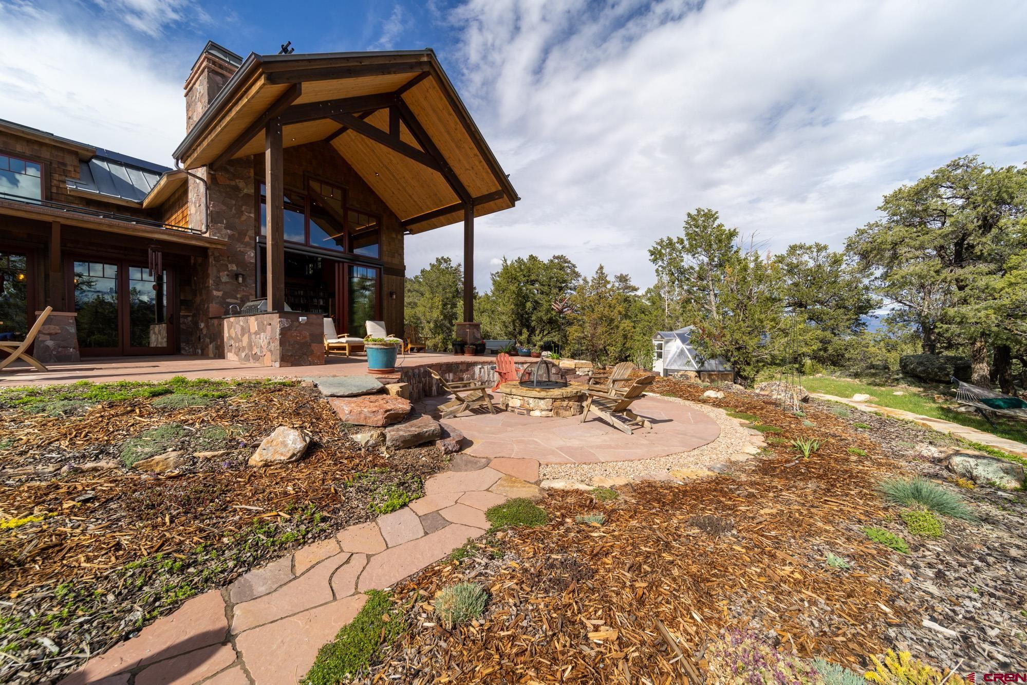 6534 Pleasant Point Drive Ridgway, CO 81432 - Photo 9 of 35 a view of a house with backyard porch and sitting area