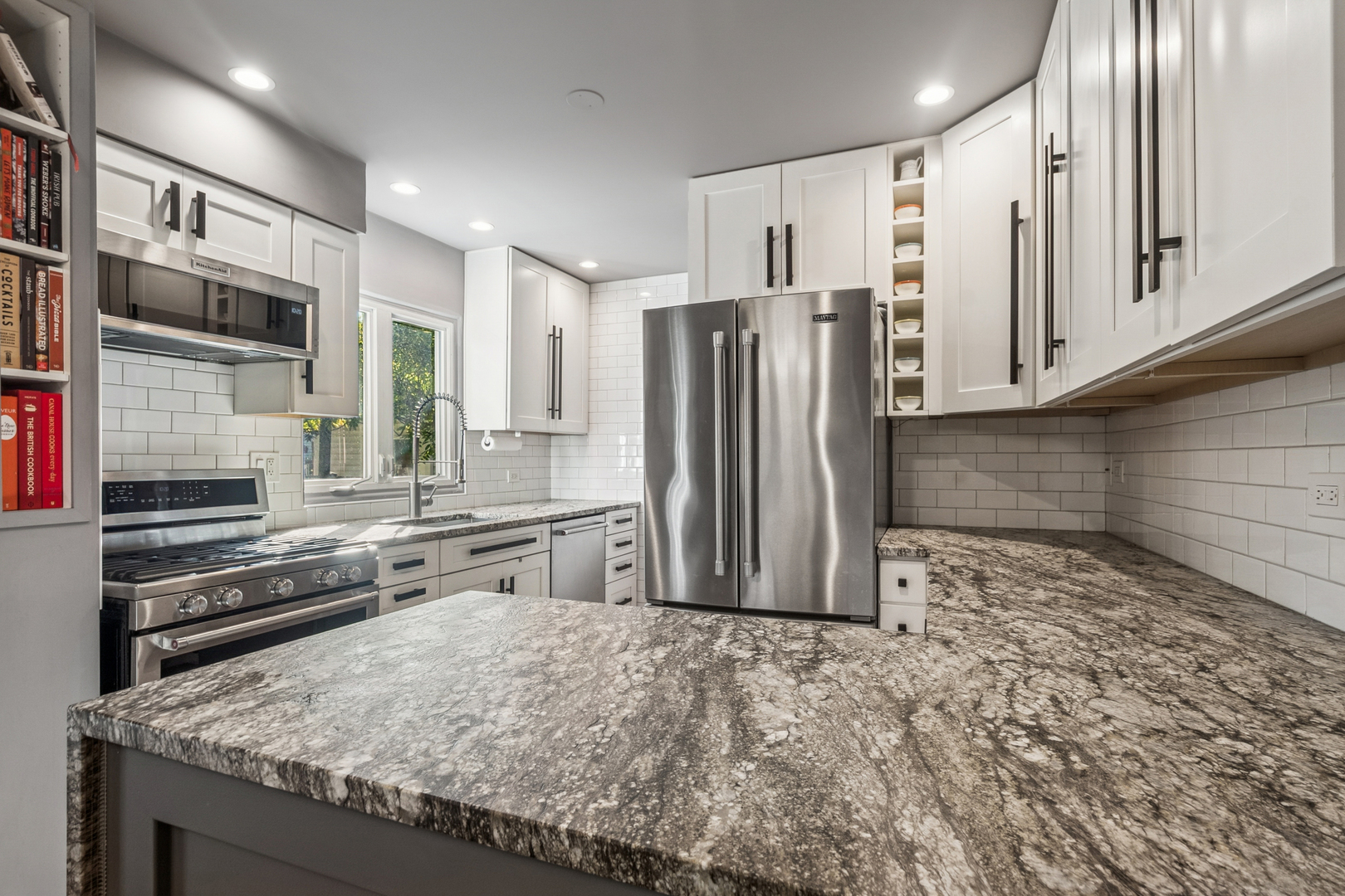 1811 Laurel Avenue Evanston, IL 60201 - Photo 11 of 34 a kitchen with stainless steel appliances granite countertop a refrigerator and a stove