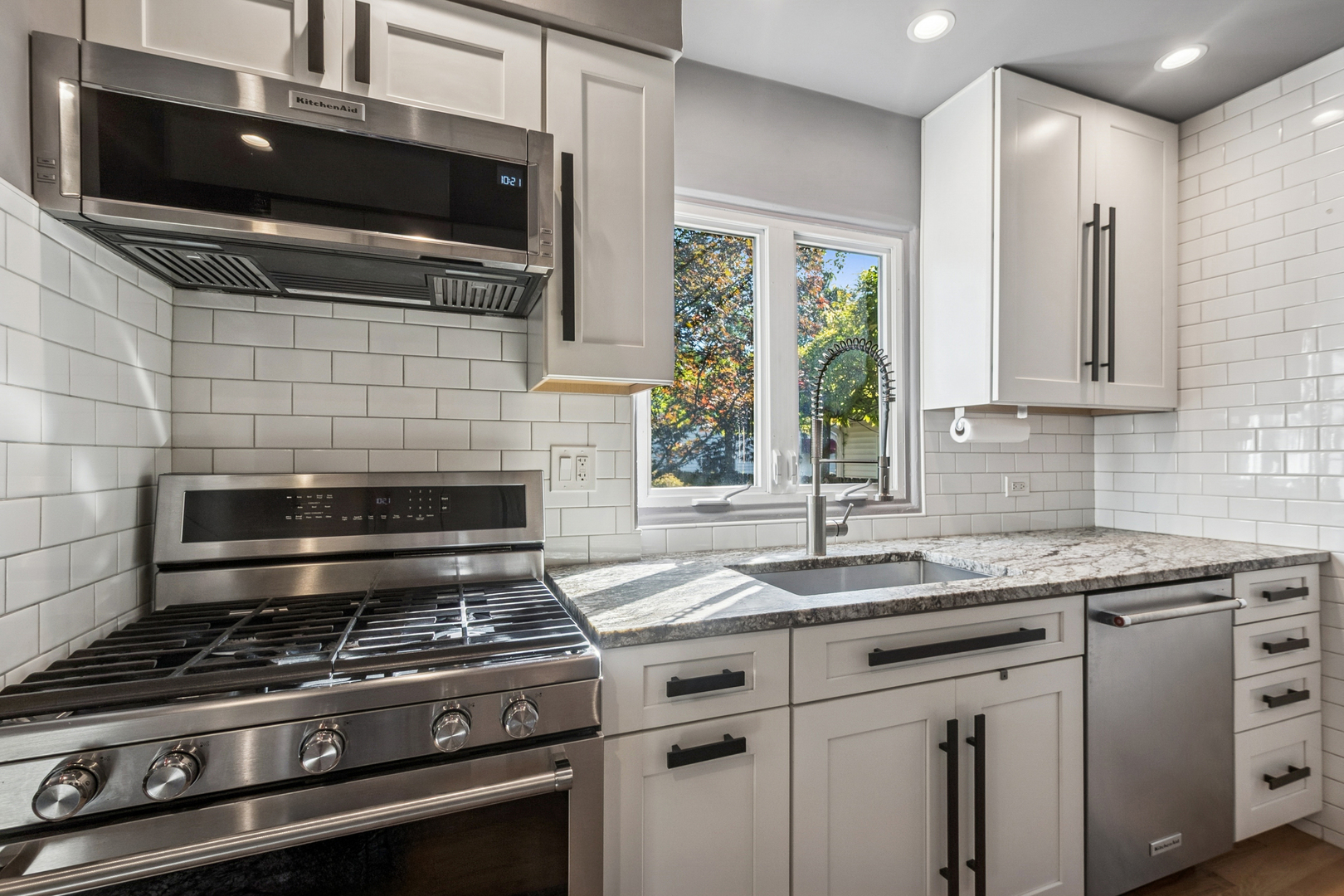 1811 Laurel Avenue Evanston, IL 60201 - Photo 12 of 34 a kitchen with granite countertop a stove and a sink