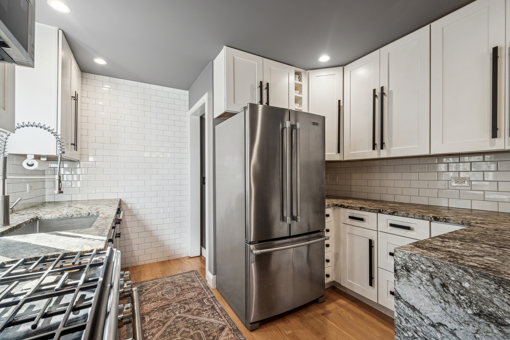 1811 Laurel Avenue Evanston, IL 60201 - Photo 13 of 34 a kitchen with stainless steel appliances granite countertop a refrigerator sink and cabinets