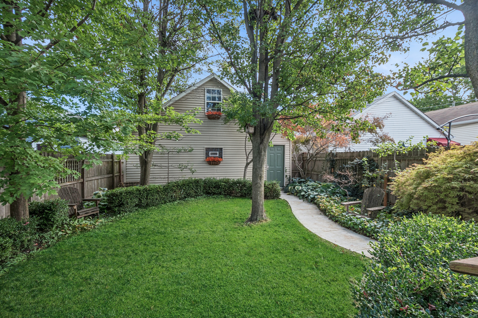 1811 Laurel Avenue Evanston, IL 60201 - Photo 27 of 34 a front view of a house with a yard and trees