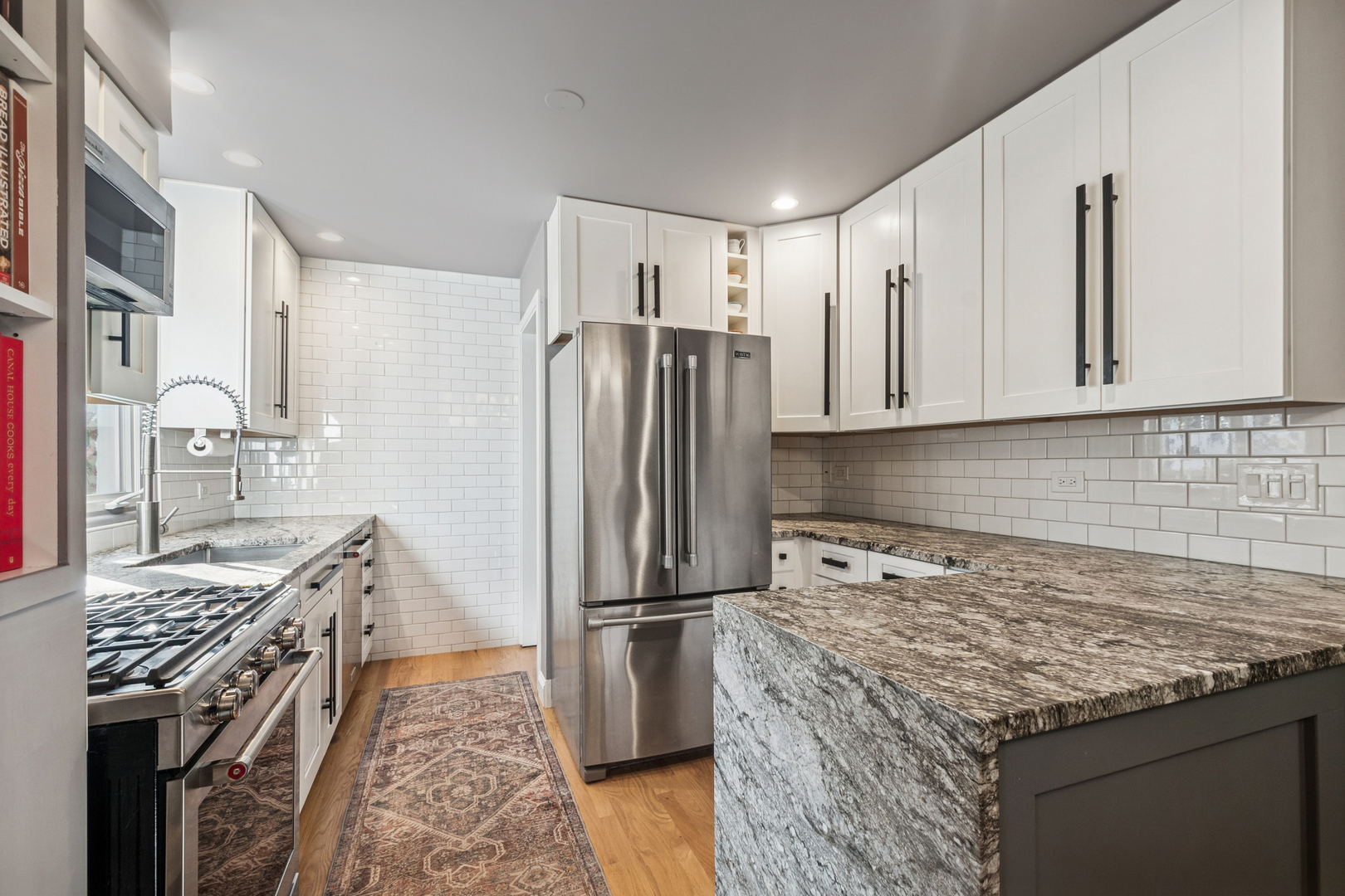 1811 Laurel Avenue Evanston, IL 60201 - Photo 10 of 34 a kitchen with granite countertop a sink stove and refrigerator