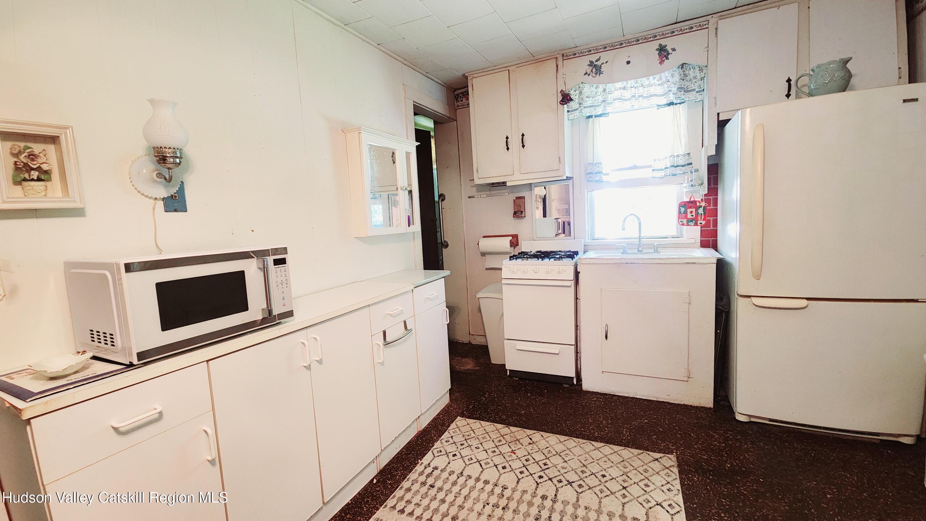 8702 Highway 32 Cairo, NY 12413 - Photo 3 of 14 a utility room with dryer and washer